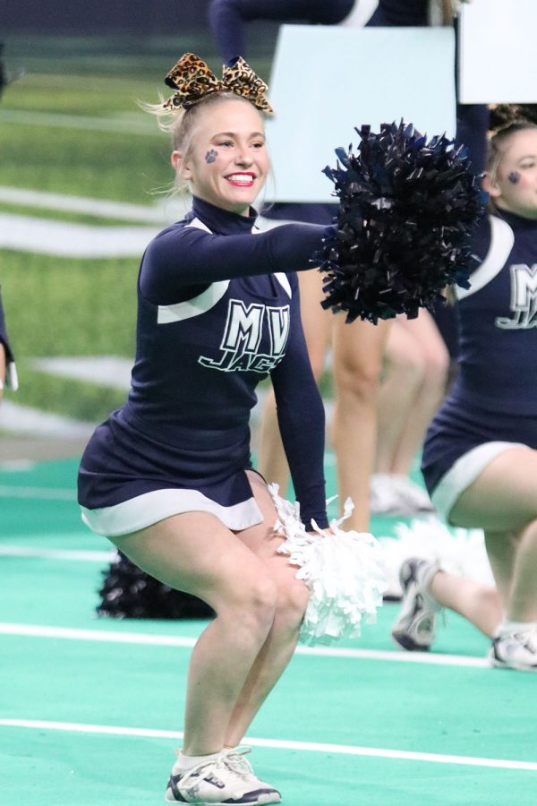 With a big smile on her face, sophomore Jaiden Fisher performs alongside her teammates at the state competition. 