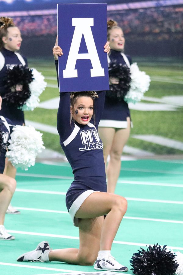 As a part of the “valley” cheer signs, senior Rheagan Handy holds the letter “A” up high.