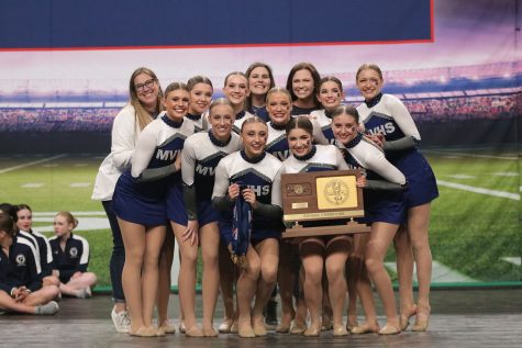 Gathering around the trophy, the Silver Stars celebrate their second state win. Due to COVID-19, the team competed digitally for the state competition last year and were ecstatic to be back in person for their second-year win where they received a final score of 94.23.