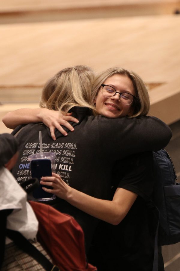 Junior Taylor Smith hugs Libby Davis after the assembly. 