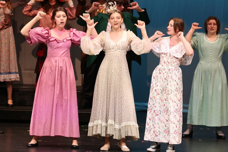 Pointing towards themselves sophomores Livianna Kirkpatrick, Kaitlyn Andrews and Tenley Moss dance in sync with the cast. 