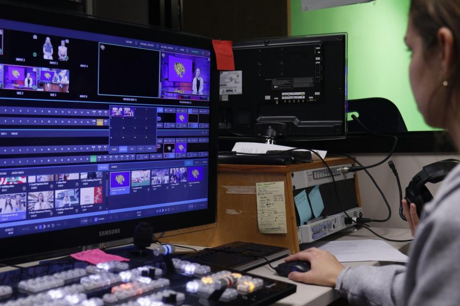 In the studio, senior Lauren Payne oversee the MVTV episode Dec. 2 Photo by Amy Hill
