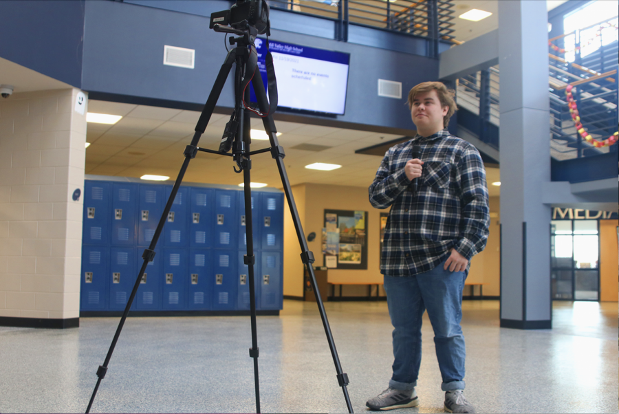 Preparing to film for his broadcast class, junior Luke O’Neal practices his script for Friday, Nov. 19 Photo by Amy Hill