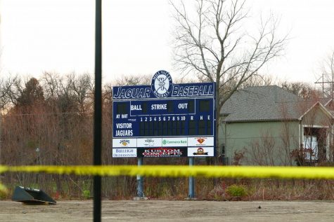 Behind yellow caution tape, the baseball scoreboard will be surrounded by a new fence next season. The fence will include a new solid navy batters eye and will cut around the right field rowdies deck; it will also be much taller than the previous fence.
