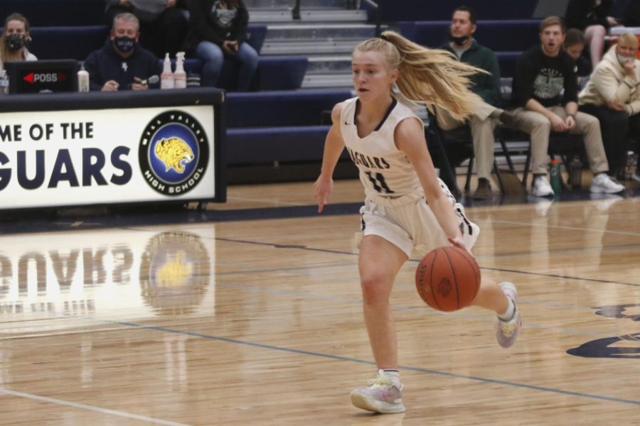 Eyes intent on the floor, junior Sophie Pringle dribbles the ball. 