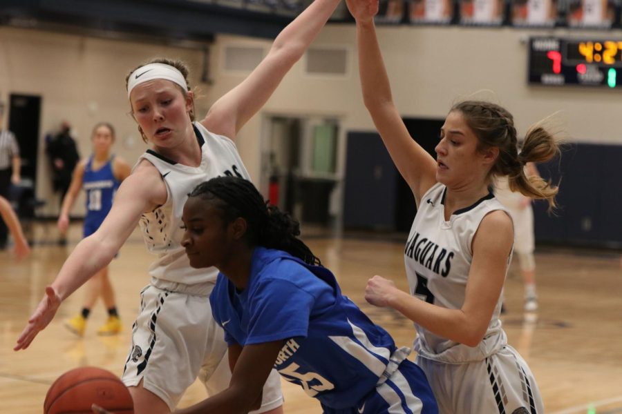 While in a full court press, seniors Emree Zars and Mackinley Fields guard a Leavenworth player. 