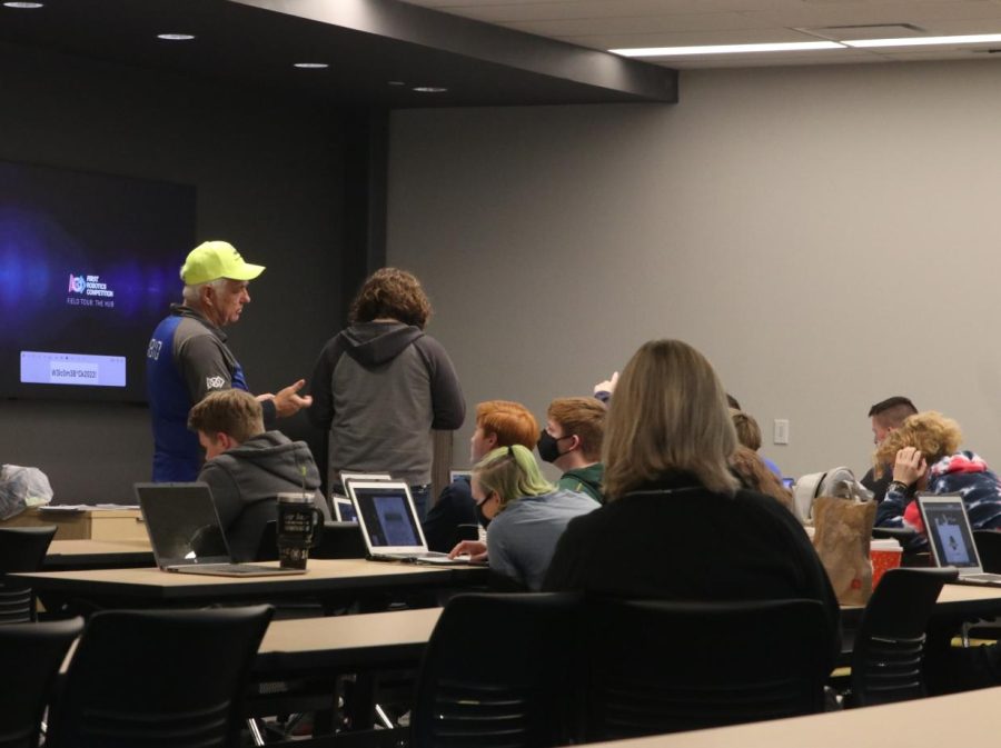 Working with a small group of robotics members, Mill Valley teacher Neil McLeod and lead mentor Gary Hannah start helping with brainstorming ideas on how they will build a robot that will meet the qualifications of the competition on January 8th.