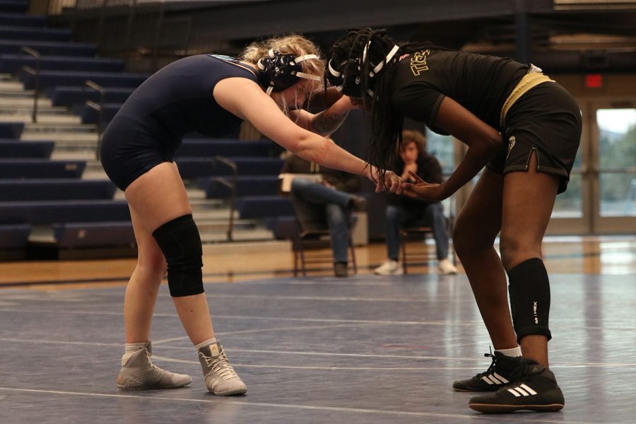 In the middle of the match, senior Rylee Allen-Atchison reaches out to her opponent as they continue to wrestle.