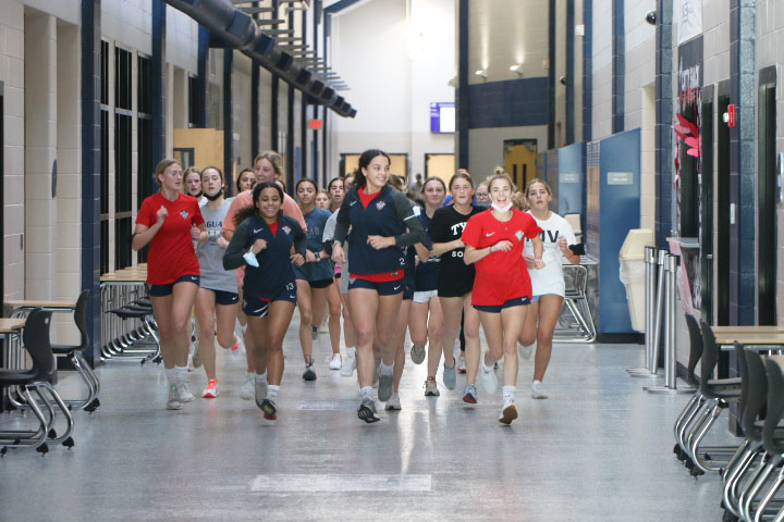 Junior Olivia Page leads the girls soccer team through their run around the school on Wednesday, Jan. 26.