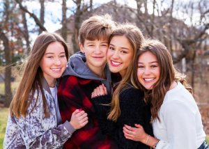 Junior Tierney Fields, far left, poses with her siblings. Fields has two older sisters and one younger brother. 