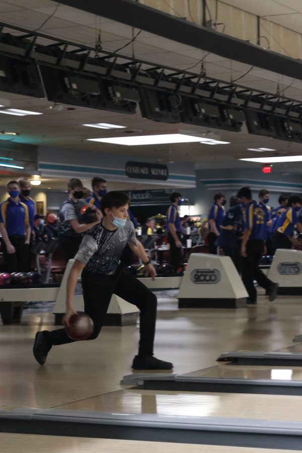 Getting ready to let go of the ball, sophomore Greyson Bruce aims for a strike.