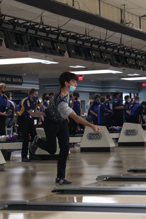 With his leg in the air, senior Jack Weber positions himself in front of the lane.
