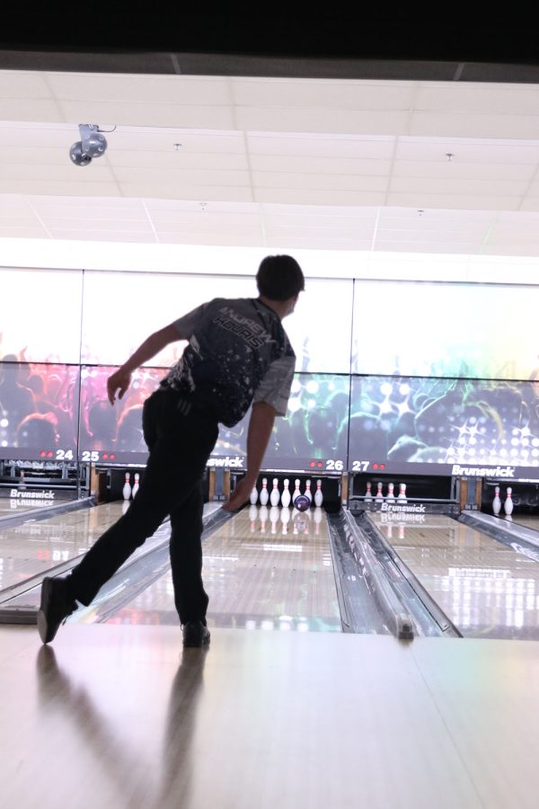 Still in the throwing pose, sophomore Andrew Kouris aims for a strike.
