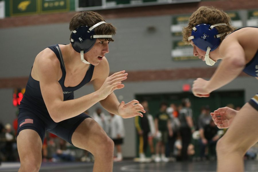 Facing off, junior Eddie Hughart circles his opponent.