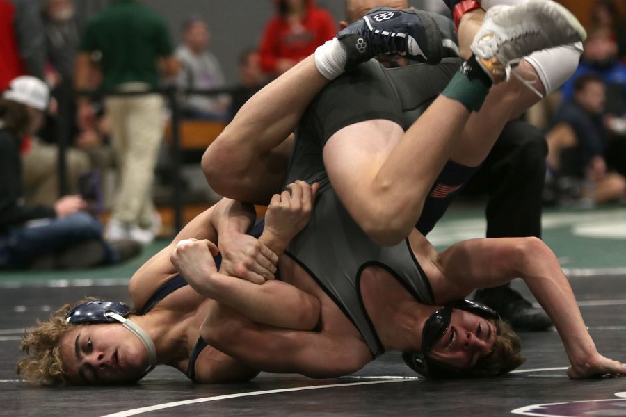 Working to get his opponent on the ground, sophomore Brady Mason attempts to flip his opponent on his back.