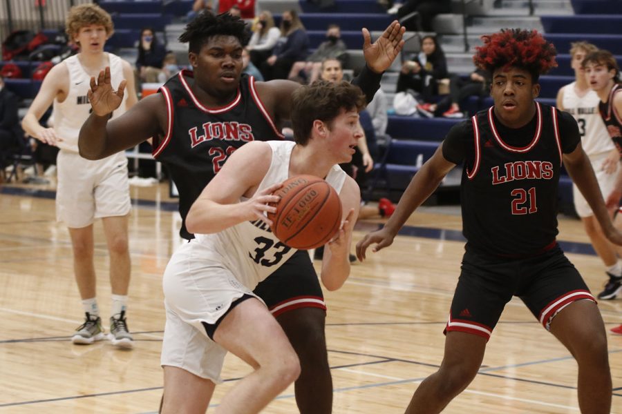 Junior Dylan Blazer gets past two guards and gets to the basket.