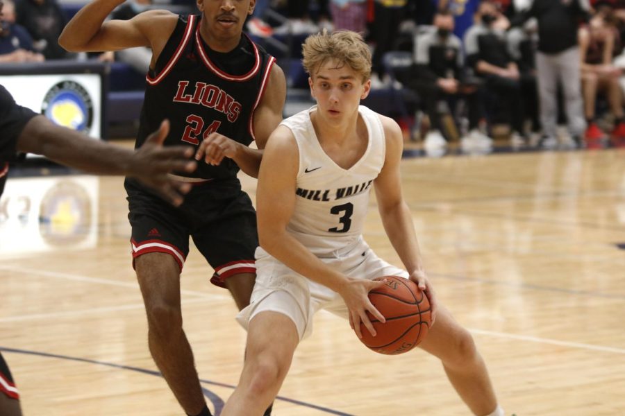 Senior Jackson Van Dyke attempts to cross to the basket for a layup.