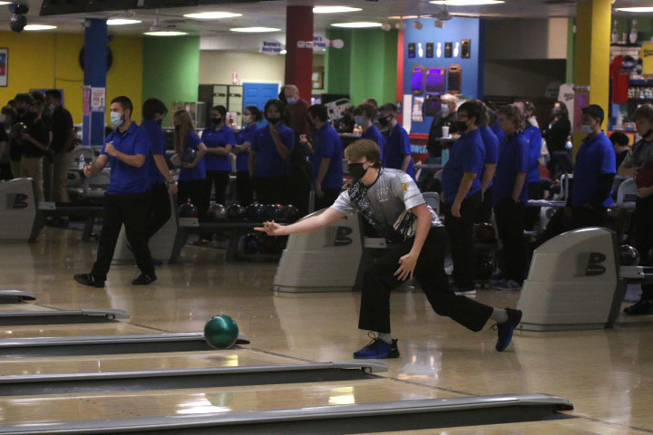 As the ball leaves his hands, junior Brody Shulda hopes to score.
