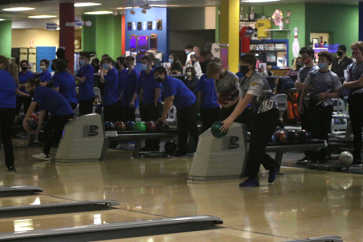 Before he gets ready to throw the ball, junior Brody Shulda positions himself in front of the lane. 