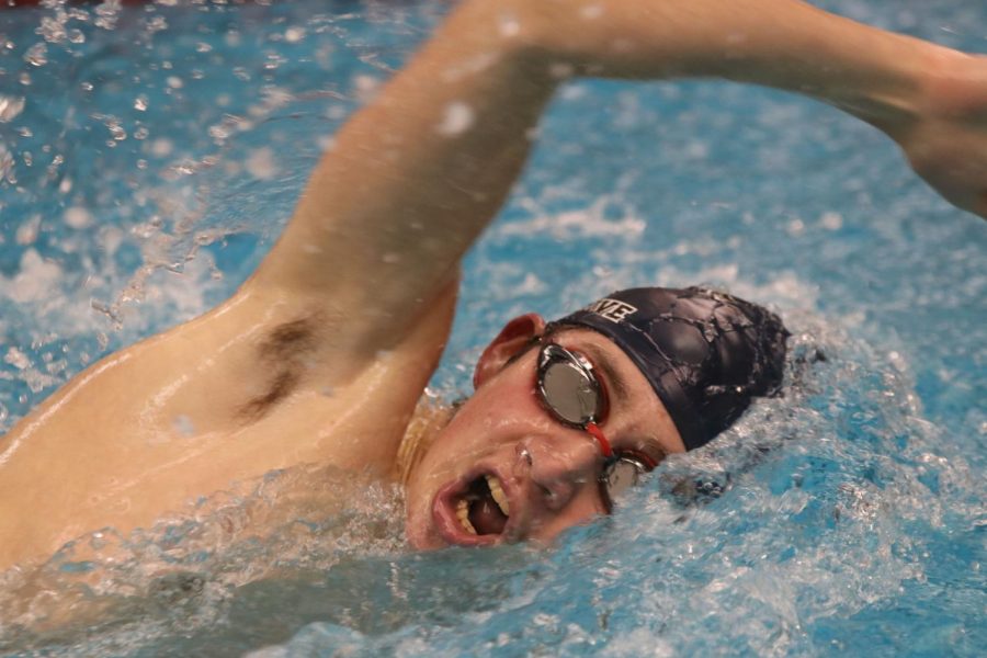 Coming up for air during the 200-yard freestyle, sophomore Andre Arnold propels himself through the water Thursday, Jan. 27. Arnold finished with a time of 2:05.73.