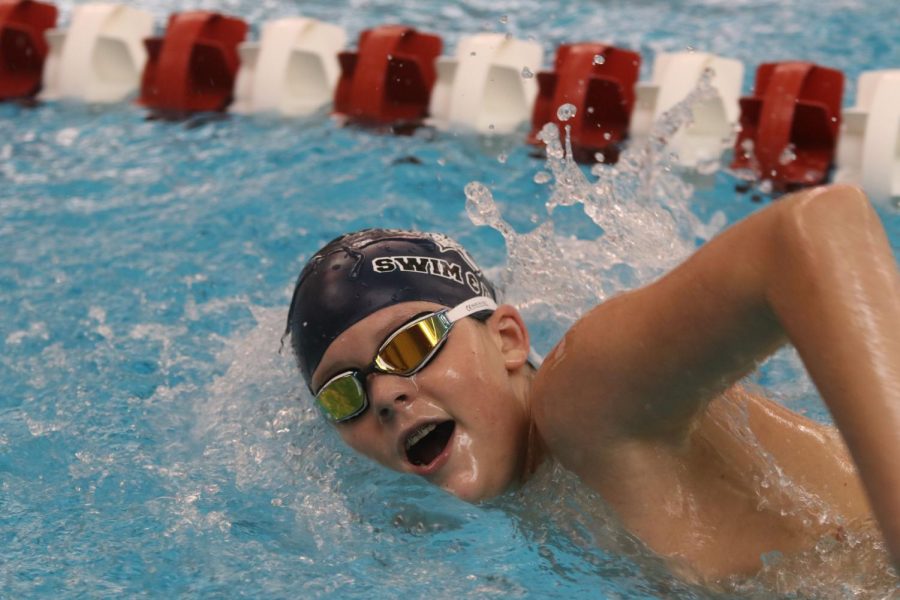 Elbow up, freshman Sawyer Clark swims the 100-yard freestyle Thursday, Jan. 27. Clark finished with a time of 1:08.41. 