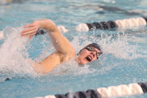 Taking a breath, senior Brendan Akehurst competes in the mens 50 freestyle Saturday, Jan. 22 where he finished with a time of 00:29.08.
