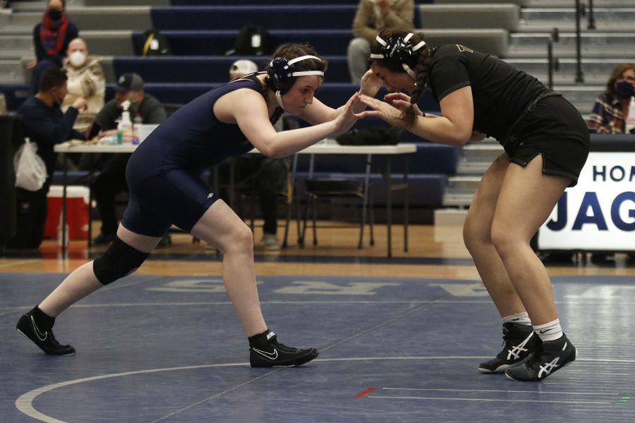Racing towards her opponent, senior Shaye Nielsen tries to keep them in the middle of the mat.