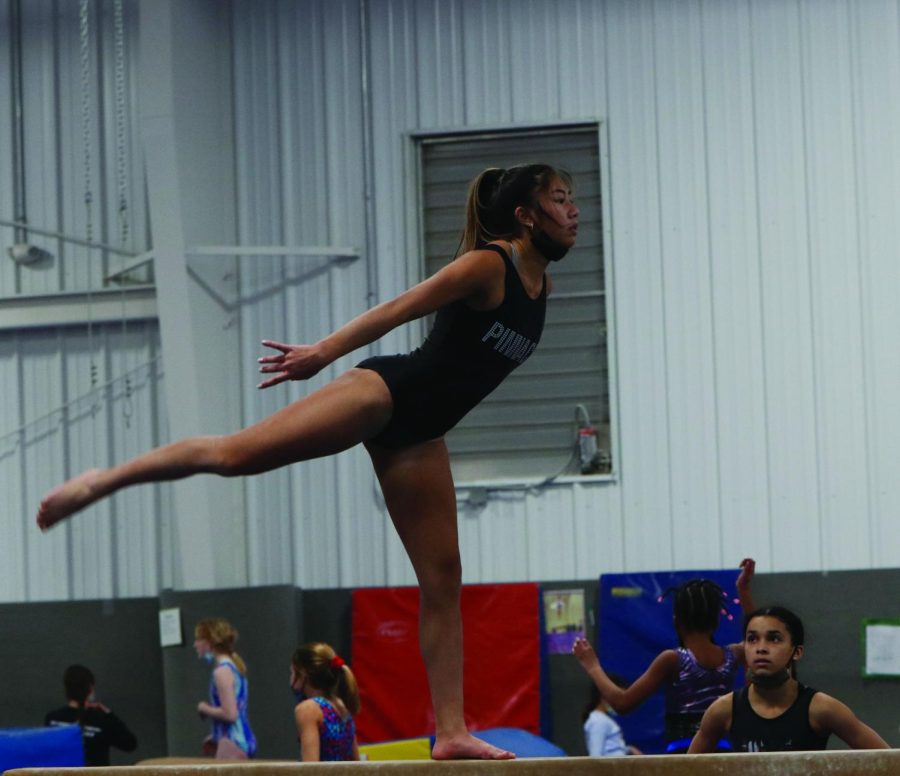 Balancing on the beam, junior Amaiya Manirad practices her routine Thursday, Jan. 29. This is Amaiya’s 9th year competing in gymnastics.