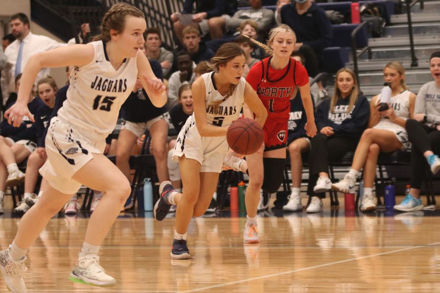 After stealing the ball, senior Mackinley Fields sprints up the court. 