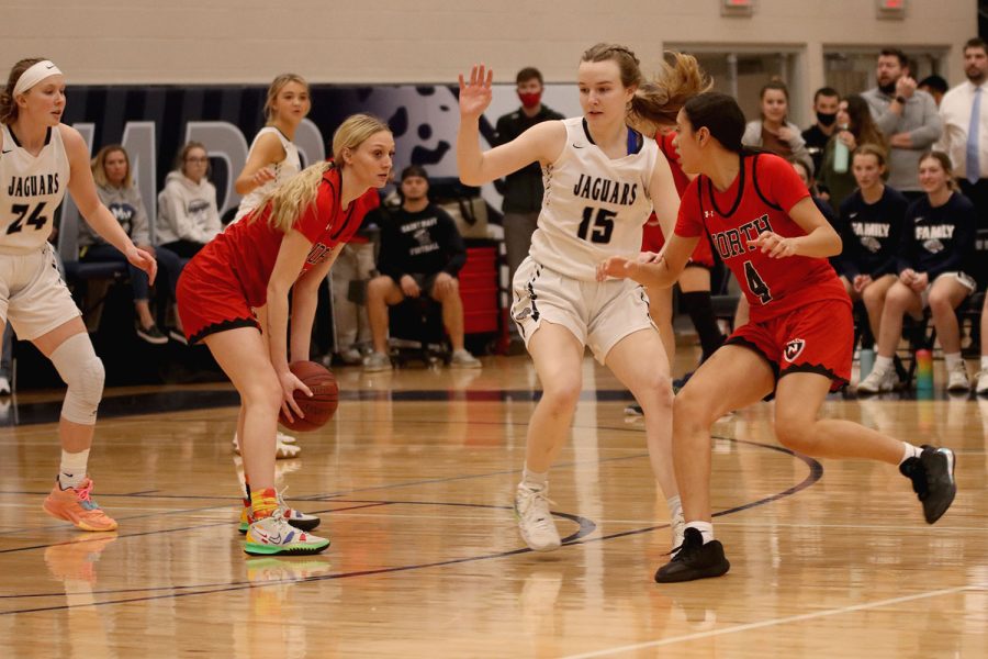 Focused on the ball, senior Greta Trowbridge moves to block her opponent from passing. 