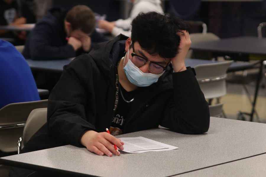 Deeply focused, junior Justin Sivilayvong reads over the paragraph of his ACT practice test. 