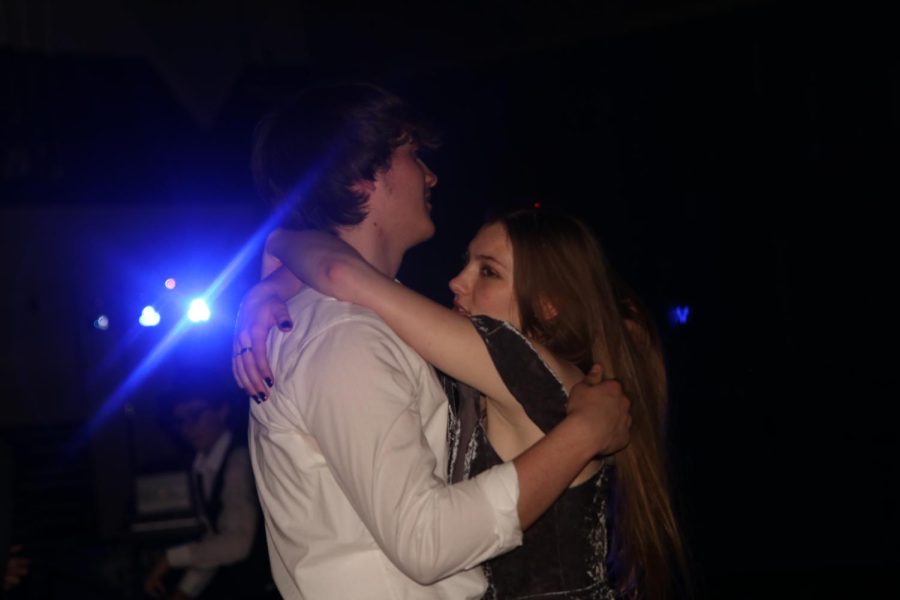 Wrapping their arms around each other, sophomores Livi Kirkpatrick and Nick Billinger slow dance to Talking to the Moon by Bruno Mars. 