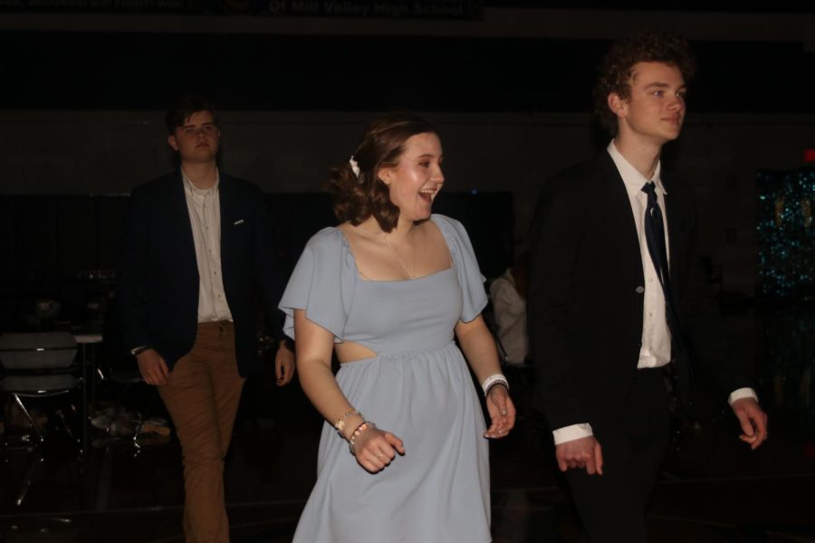 Heading to the dance floor, juniors Atticus O’Brien, Asa Esparza and Finn Campbell walk to the dance floor. 