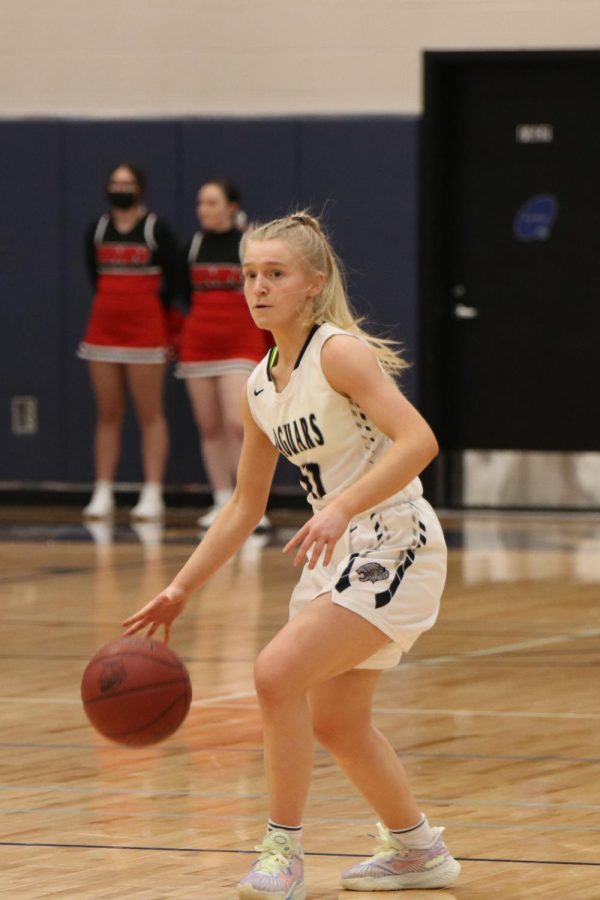 After being passed the ball, junior Sophie Pringle makes her way down the court.