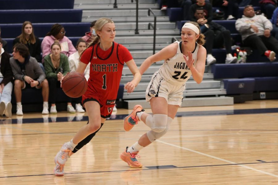 In a full court press, senior Emree Zars guards a Shawnee Mission North player.