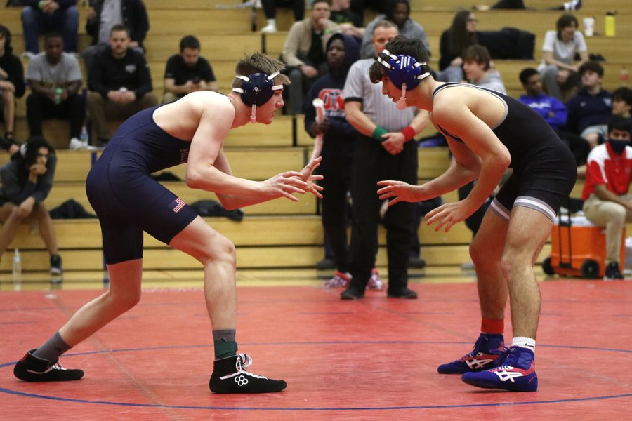 Circling his opponent, junior Sam Imes searches for a way to pin his opponent.