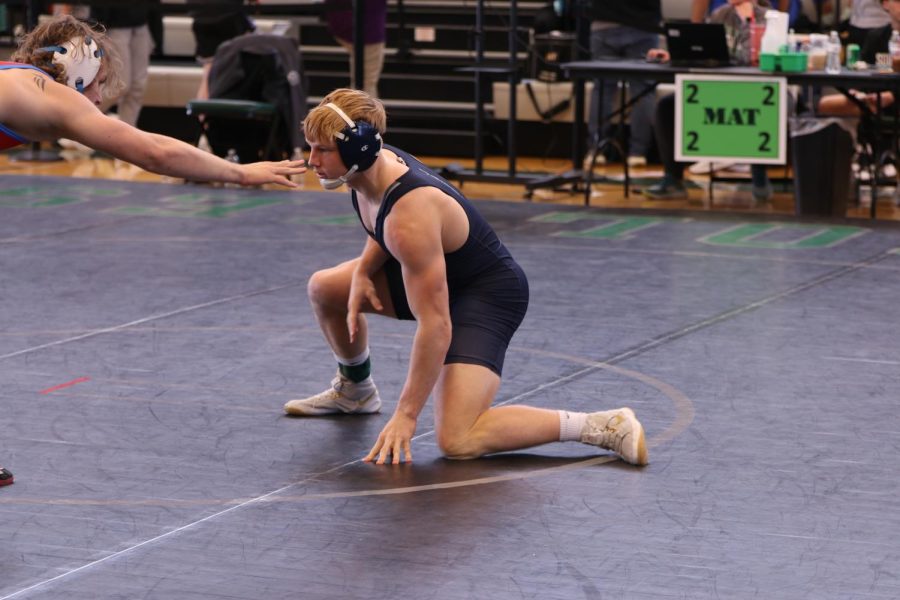 Junior Holden Zigmant puts himself in a defensive position against his opponent.