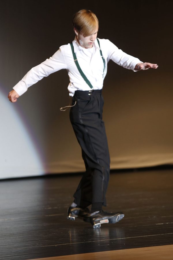 Twisting his ankle, junior Carter Harvey sings and tap dances to I Can Do That from A Chorus Line for his talent.