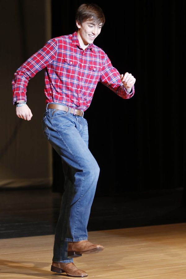 Hopping on one foot, junior Marko Skavo line dances to Cotton-Eyed Joe and Footloose.