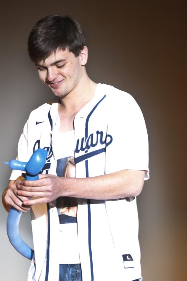 Senior Nick Brubeck makes dog shaped balloons for his talent.