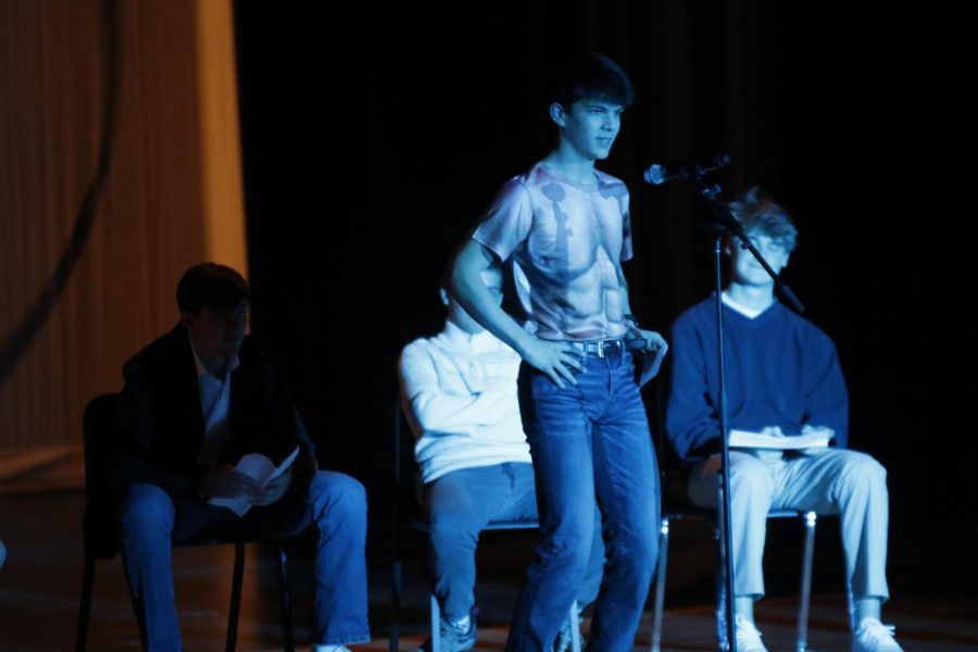 "Taking off" his shirt, junior Lucas Robins recites the lyrics of "I'm Too Sexy" by Right Said Fred.