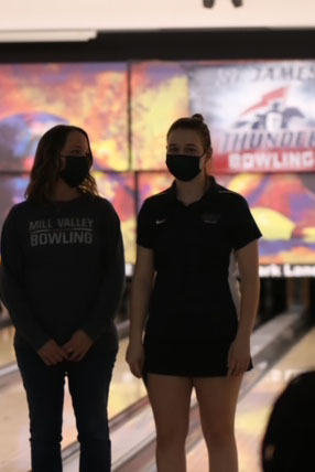 As she stands with her mother, senior Abby Hayes is recognized for senior night. 