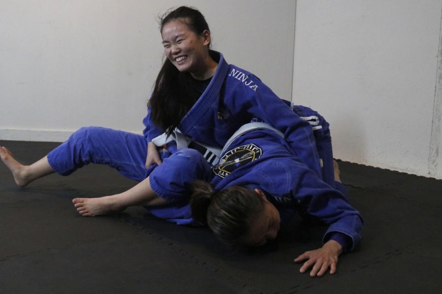 After tackling her mom, junior Sophia Chang pins her mother to the ground.