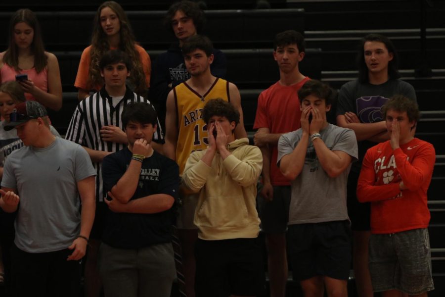 The student section makes noise while Lansing shoots a free throw.