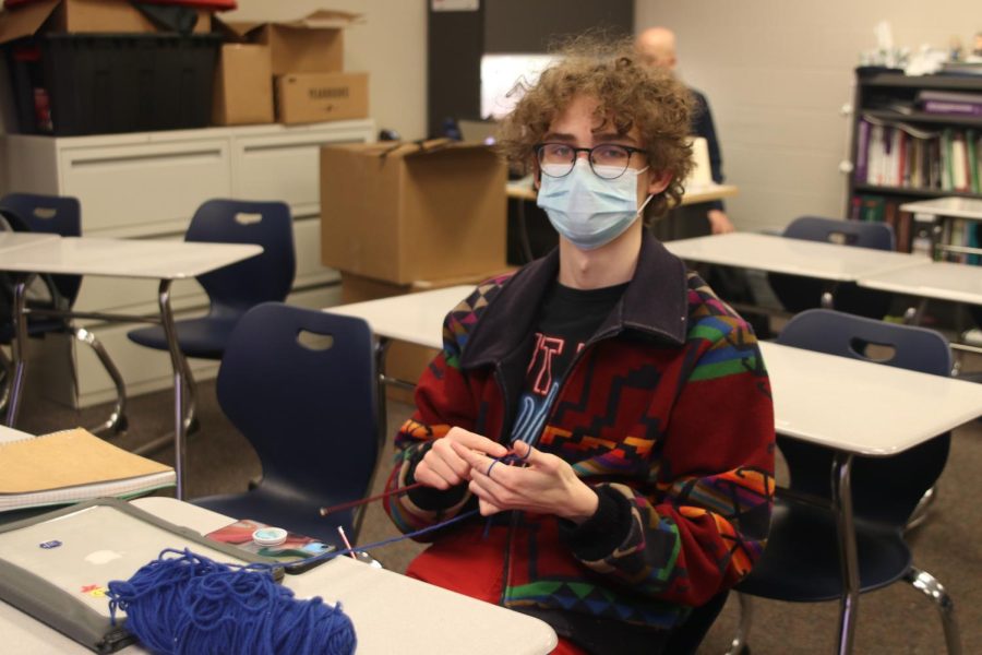 Sitting in seminar, junior Sean Olin starts working on a new hat Monday, Feb 28.