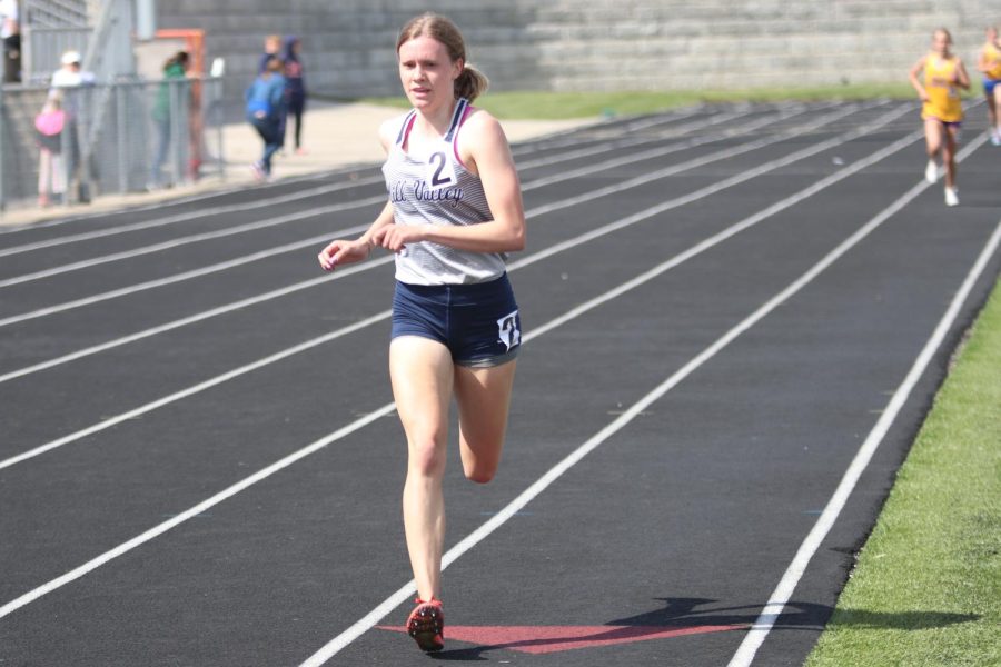 Focusing on the finish line ahead of her, senior Katie Schwartzkopf runs in the 1600 meter race.  