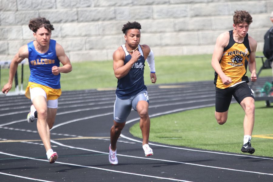 Eyes focused on the track ahead of him, junior Sidney Lockhart pushes forward. 
