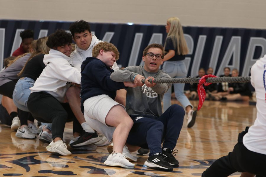 While leaning back, the sophomore tug of war team struggles to beat the junior team.