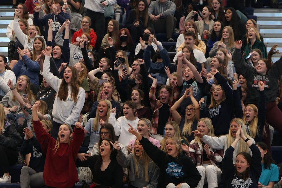 As the tug of war game reaches an end, the sophomore section cheers for their grade representatives.