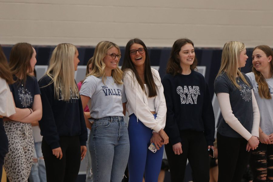 Smiling, the cheer team is recognized for placing third at state.